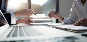 Man and woman sharing ideas at a desk