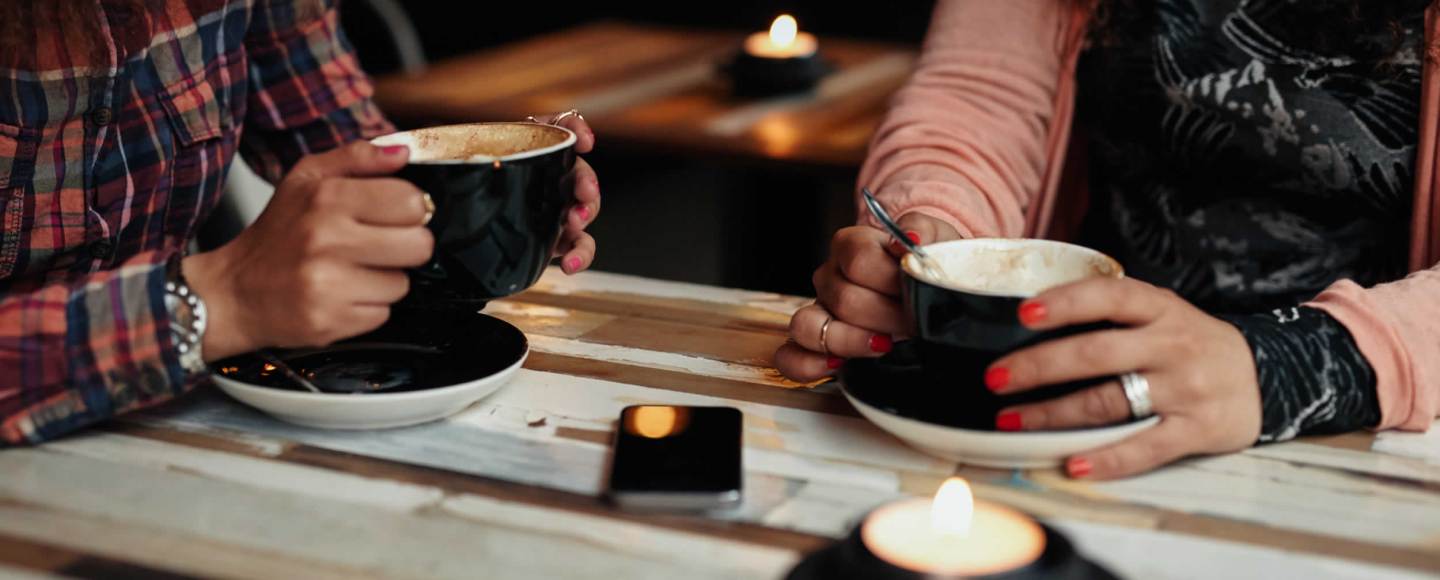 Two business women consulting at coffee shop